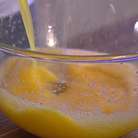 Взбить яйца и 2 желтка со 100 г сахара и солью, затем тонкой струйкой влить растопленное масло, все перемешать и ввести в опару. 