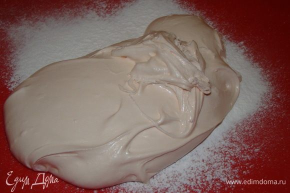 когда станет тяжело мешать - вымешивать на рабочей поверхности, как тесто, только вместо муки подпылять сахарной пудрой.